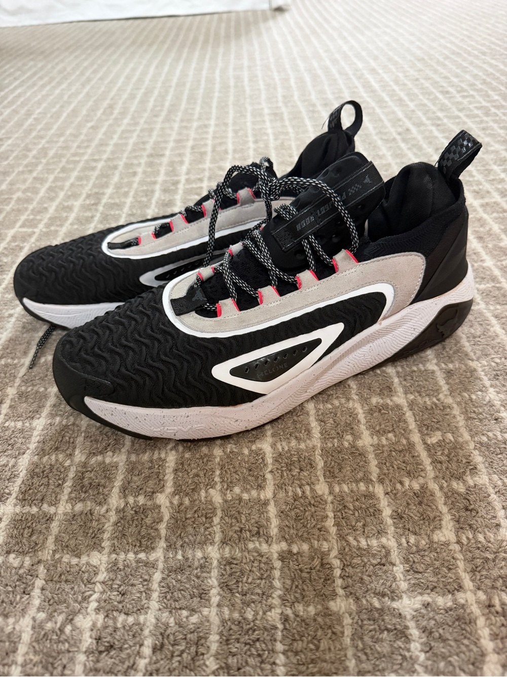 Under Armour Black and White Sneakers with Pink Accents